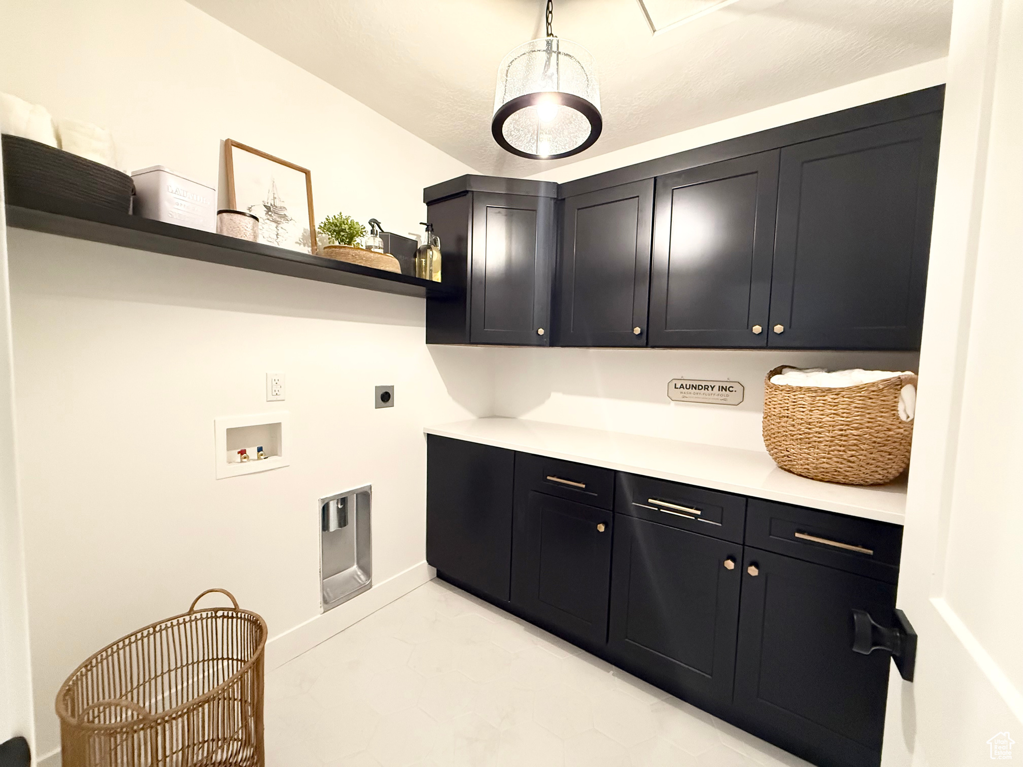 Laundry area featuring electric dryer hookup, cabinets, and hookup for a washing machine