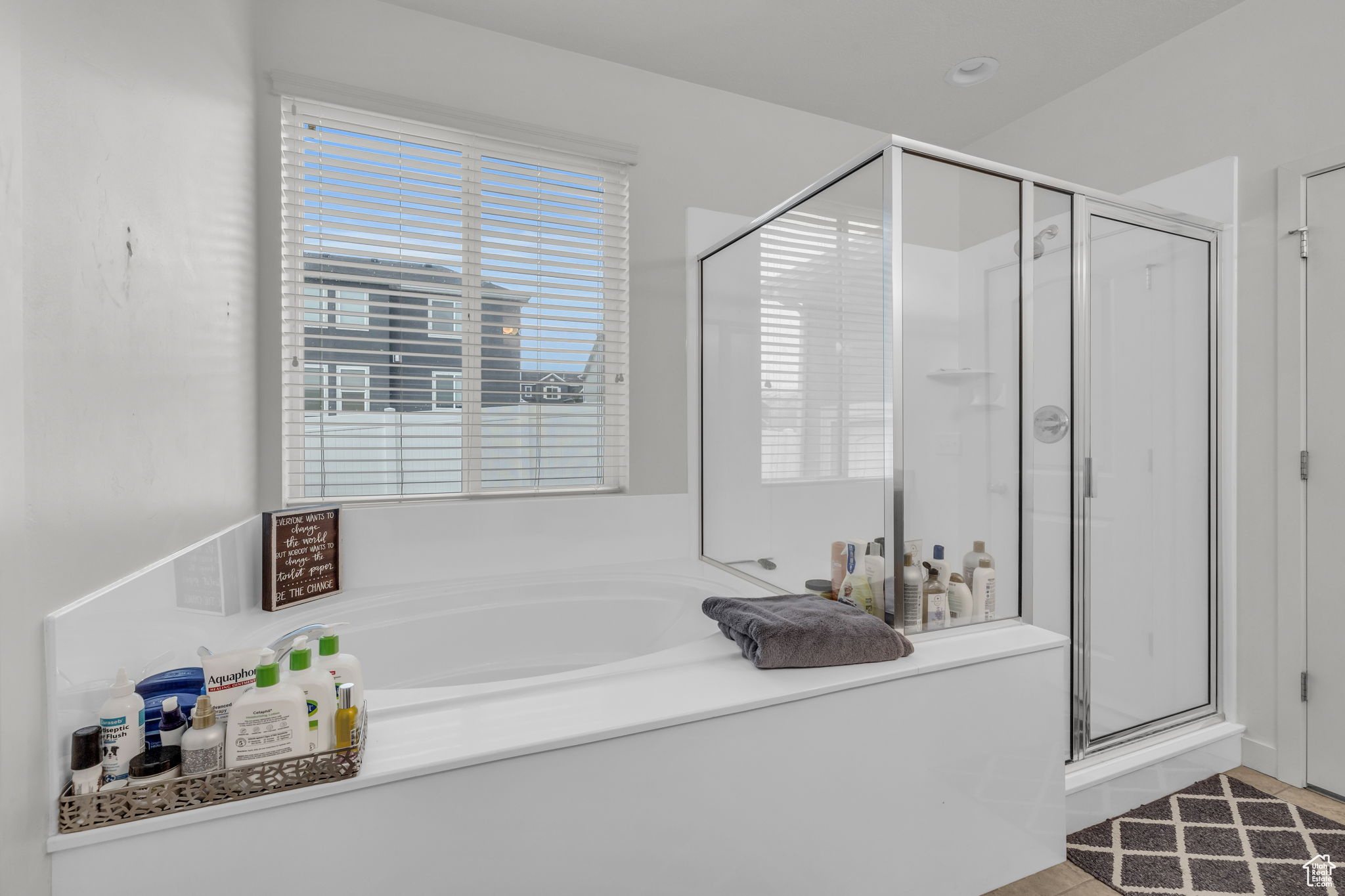 Bathroom featuring separate shower and tub