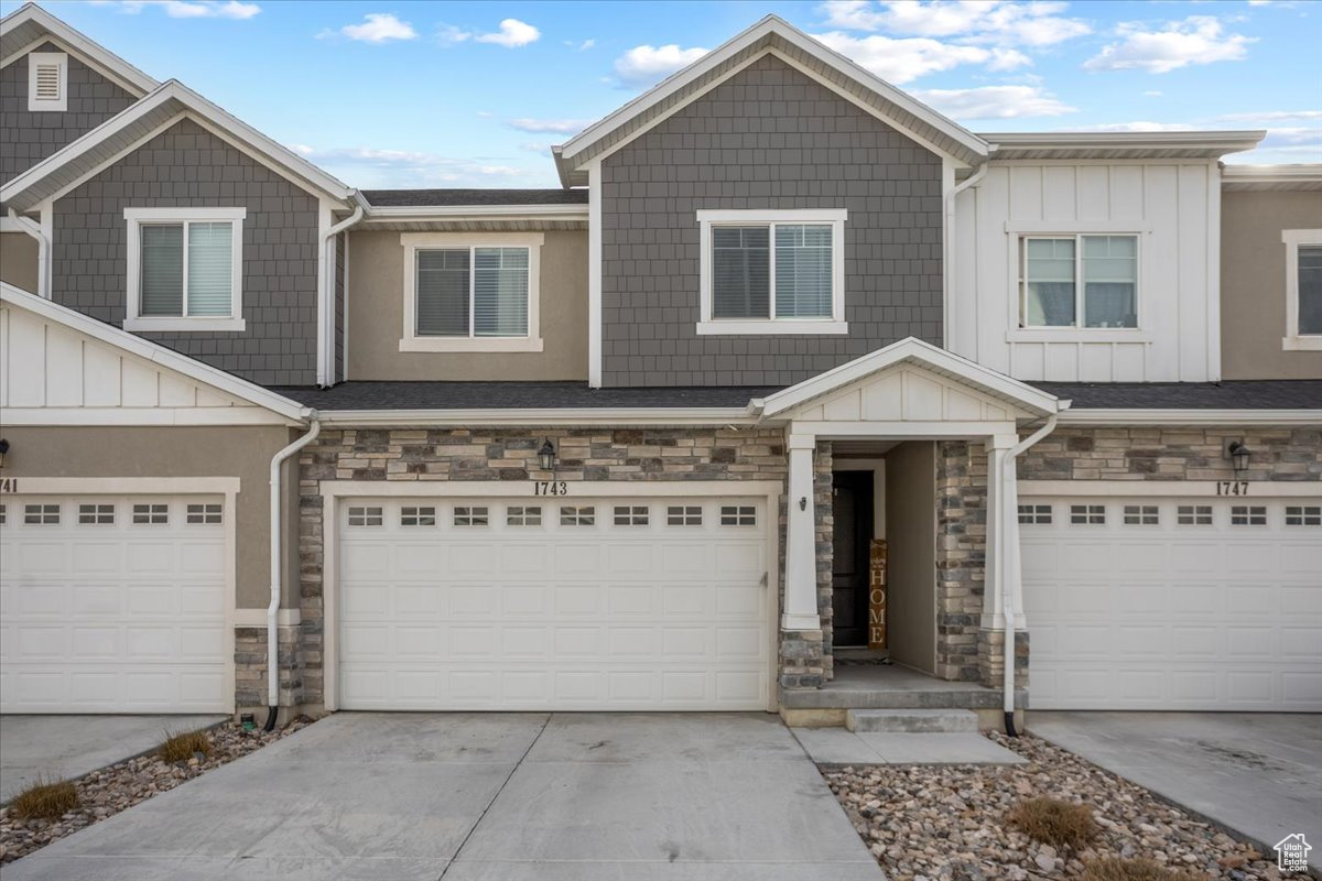 View of front of property featuring a garage