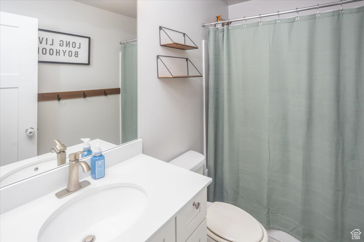 Bathroom with vanity and toilet