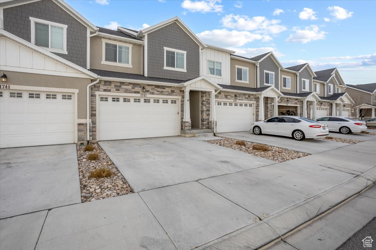 View of property featuring a garage