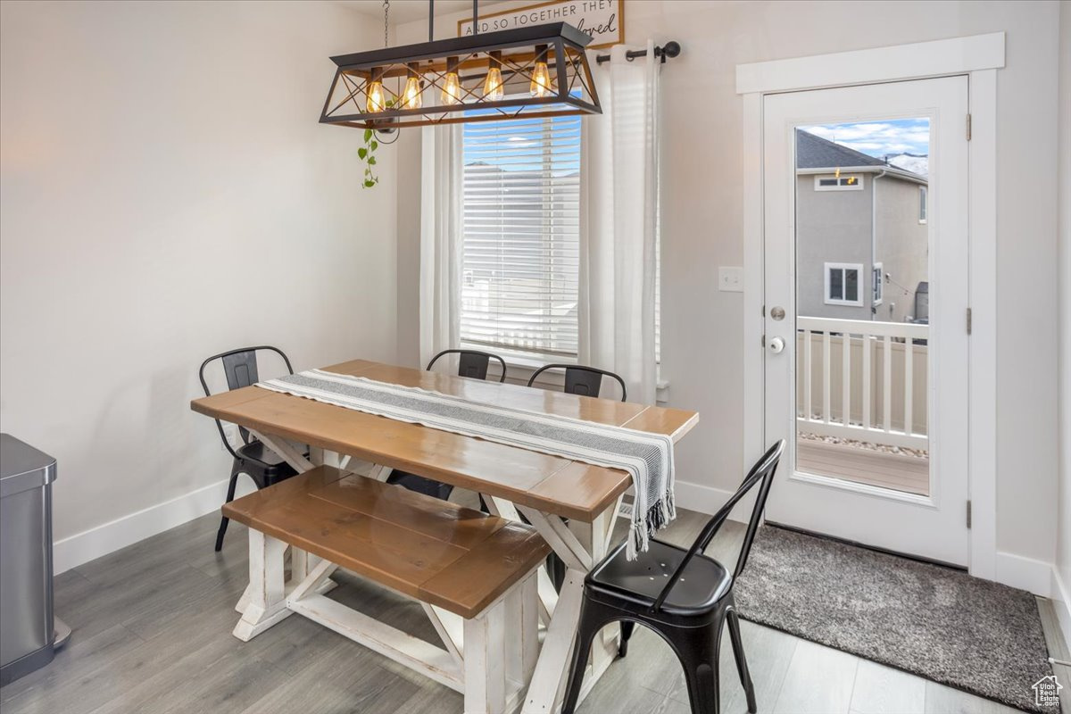 Dining space with wood-type flooring