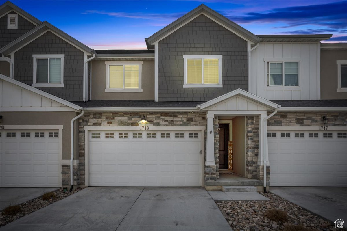 View of front of property featuring a garage