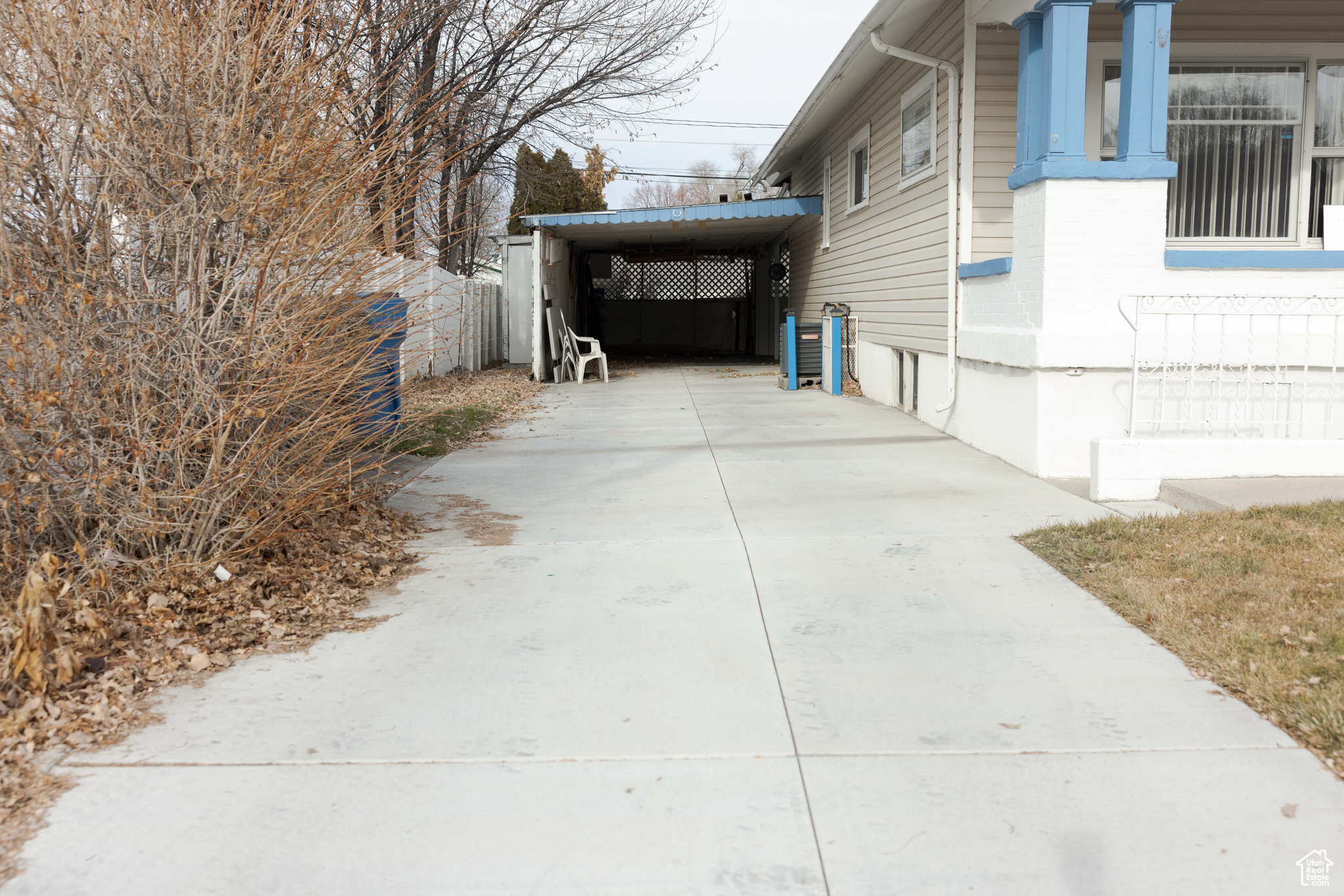 View of side of property featuring a carport