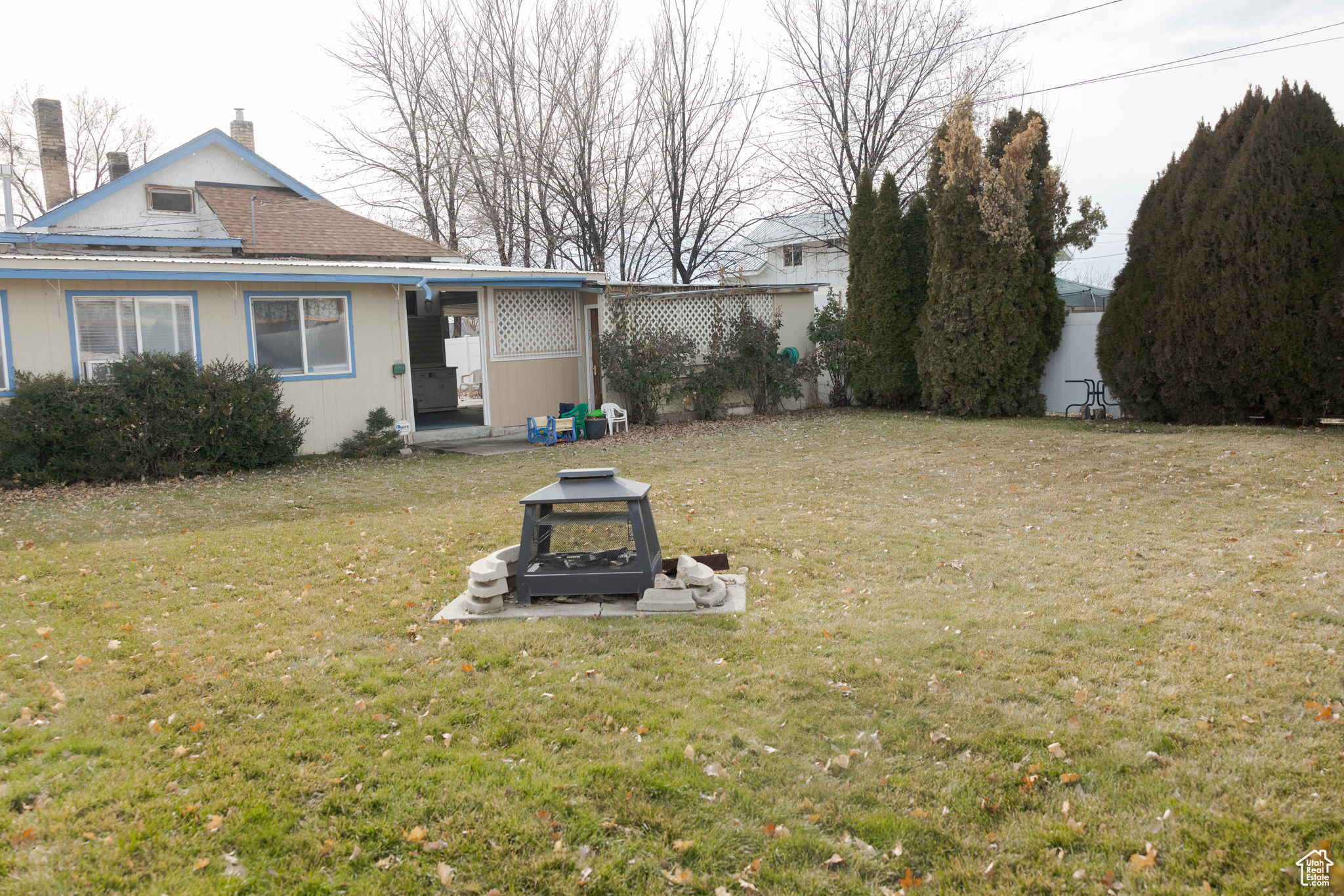 View of yard with an outdoor fire pit