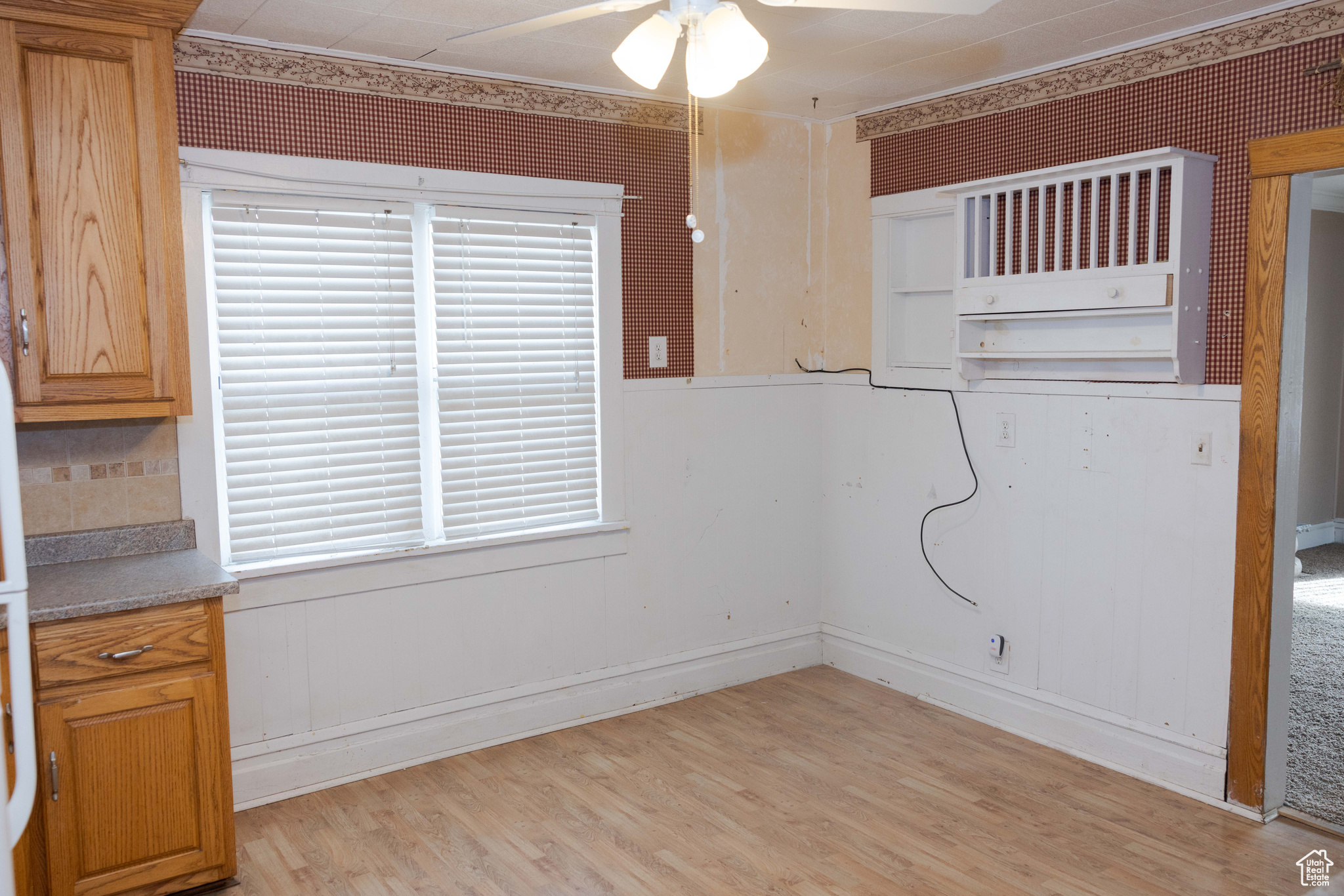 Interior space with light hardwood / wood-style floors and ceiling fan