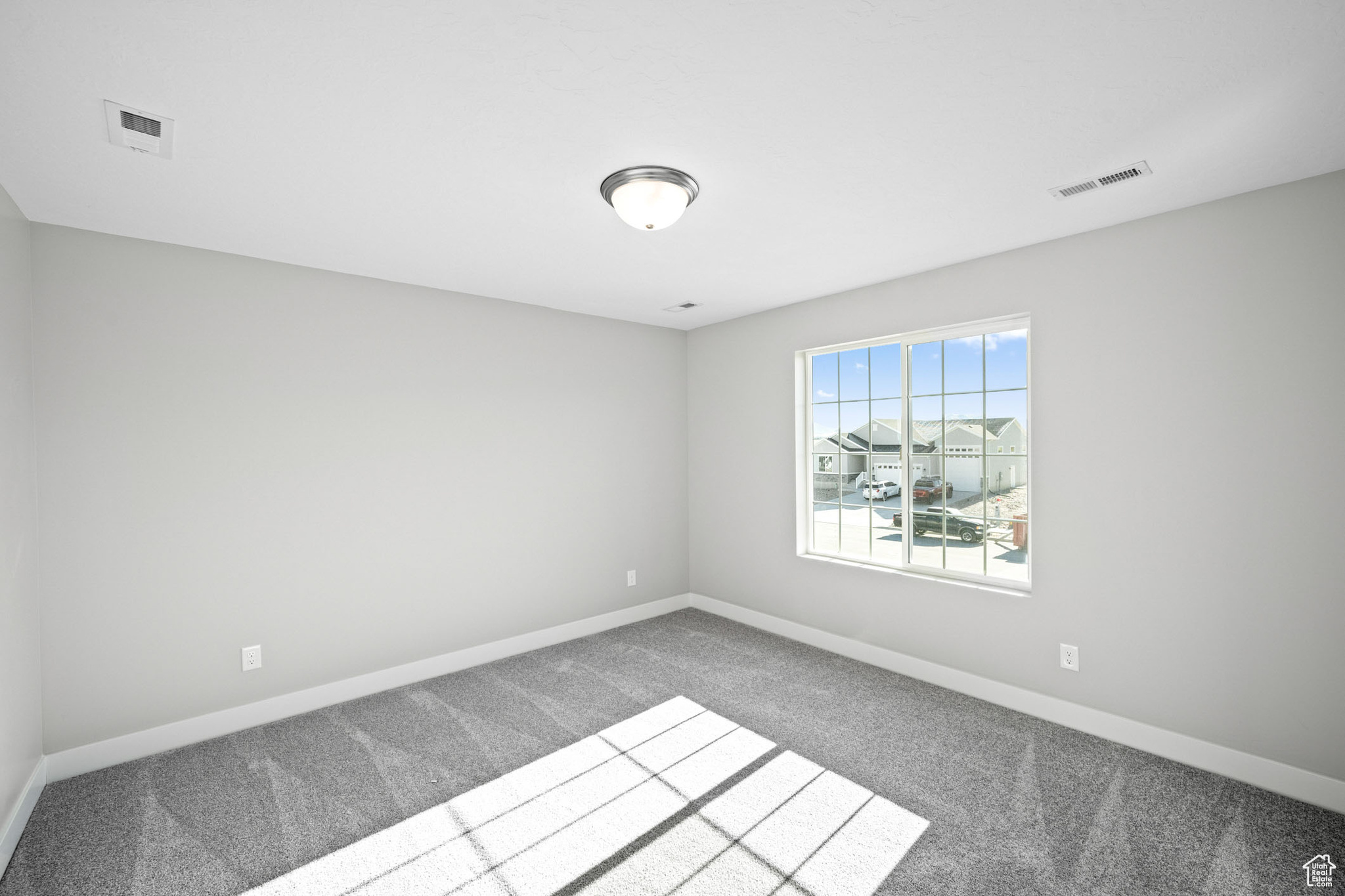 Empty room with carpet flooring