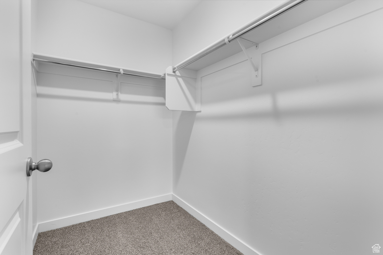 Spacious closet with carpet floors