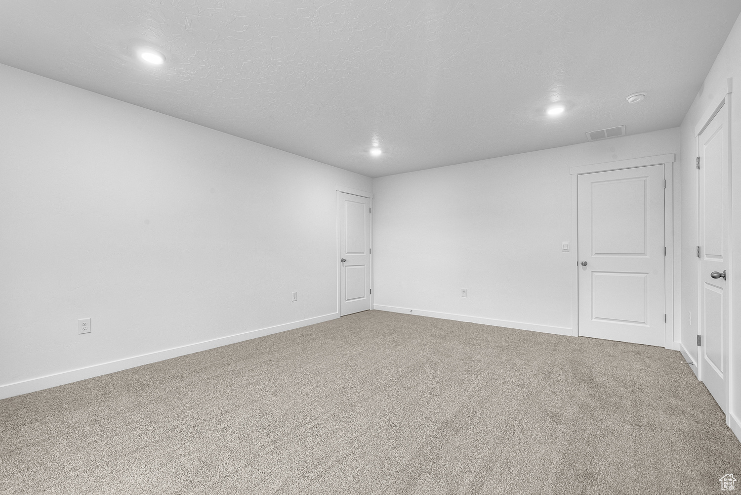 Empty room with carpet flooring