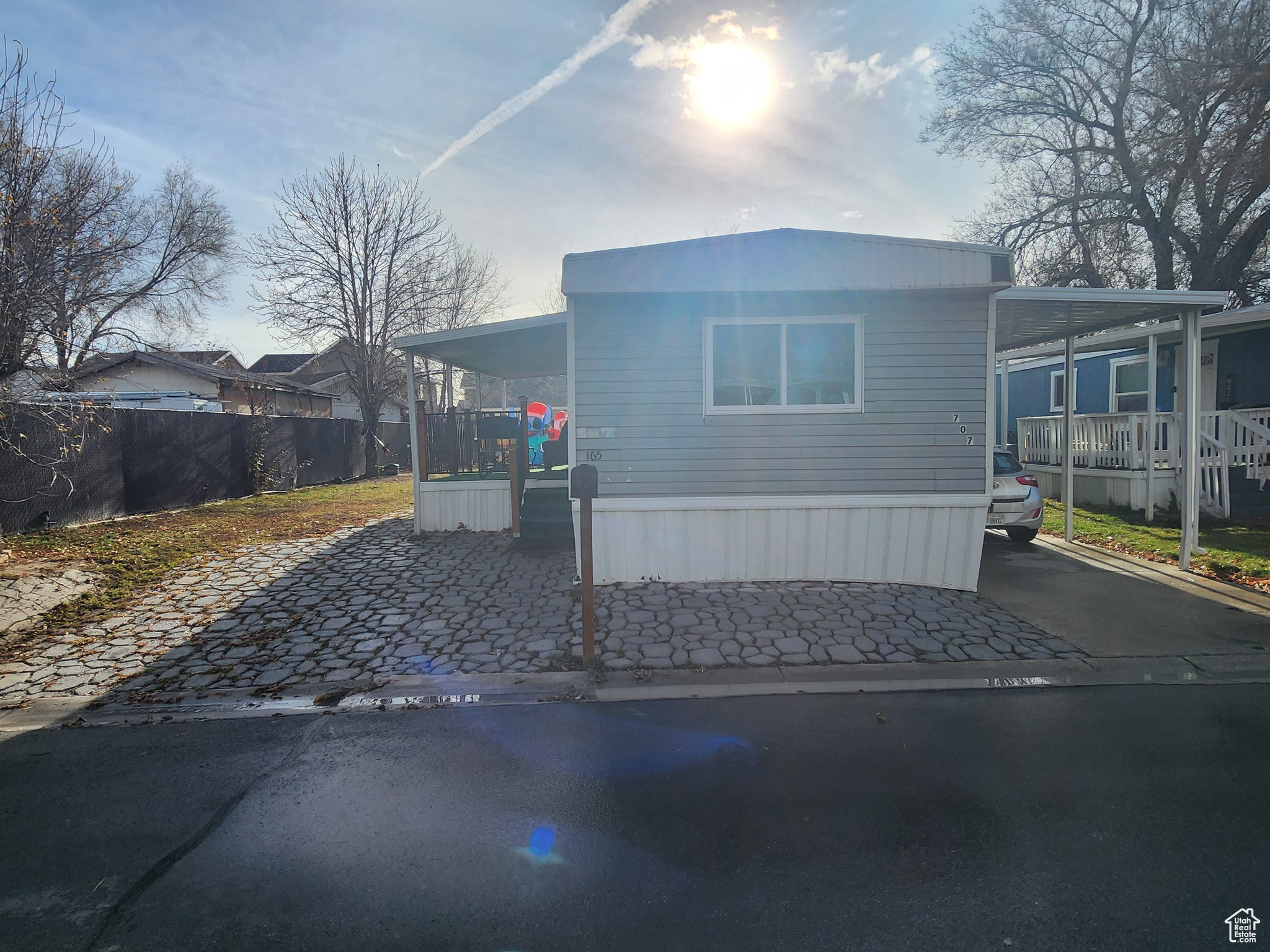 View of front of property featuring a carport