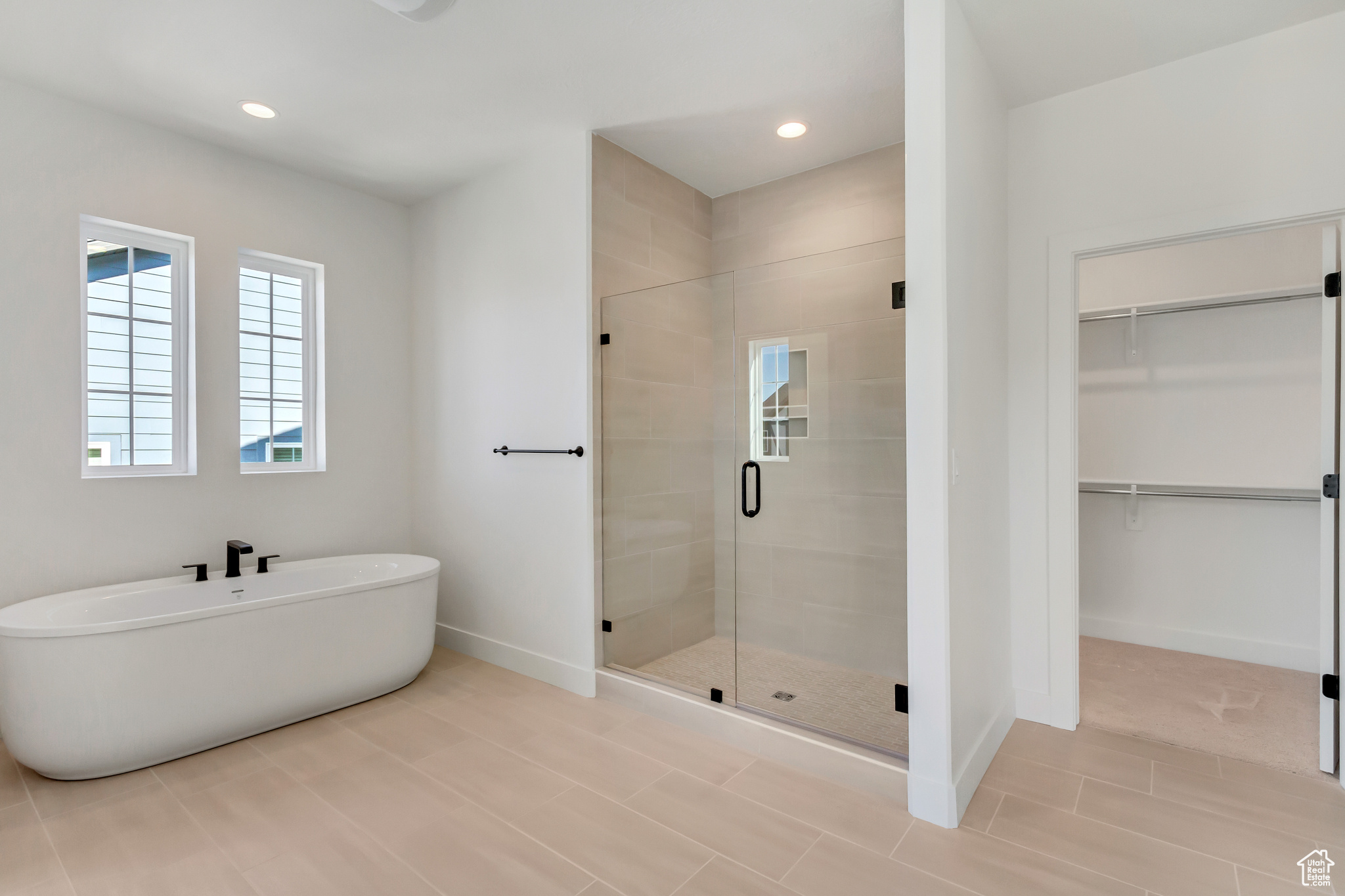 Bathroom featuring independent shower and bath