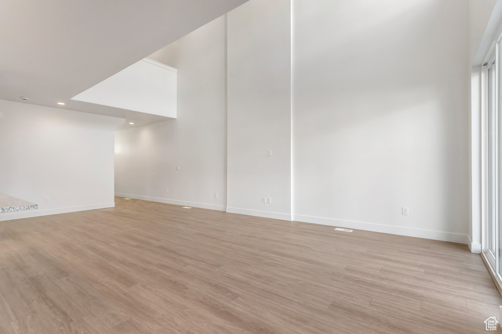 Empty room featuring light hardwood / wood-style flooring