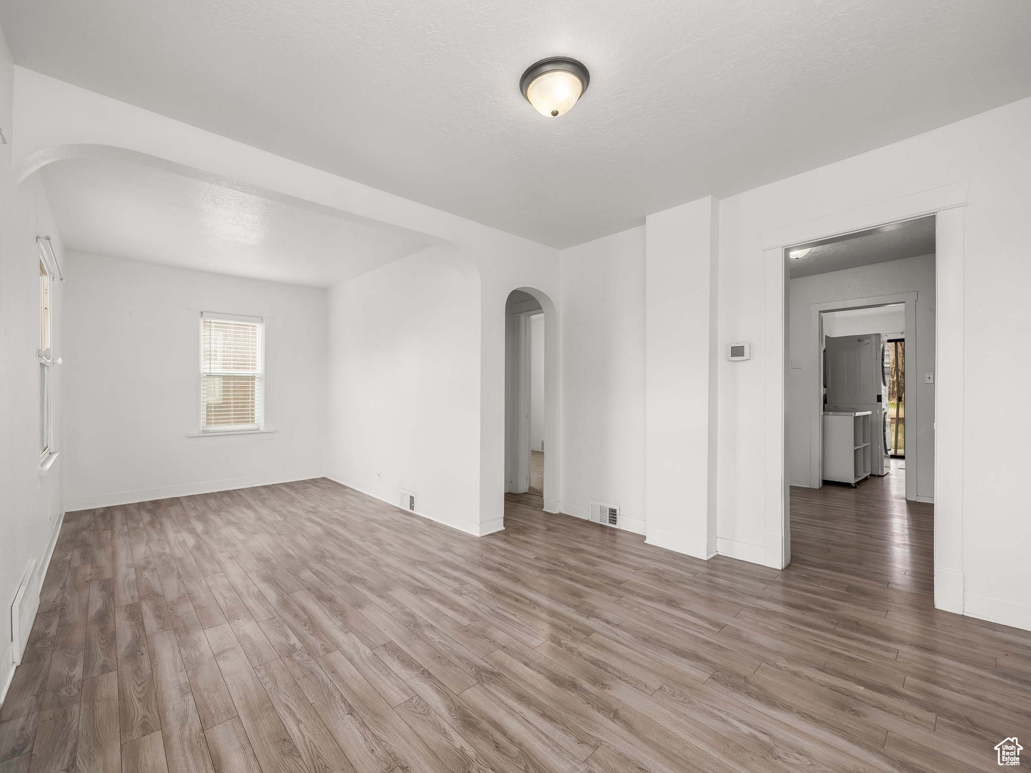 Spare room featuring hardwood / wood-style flooring