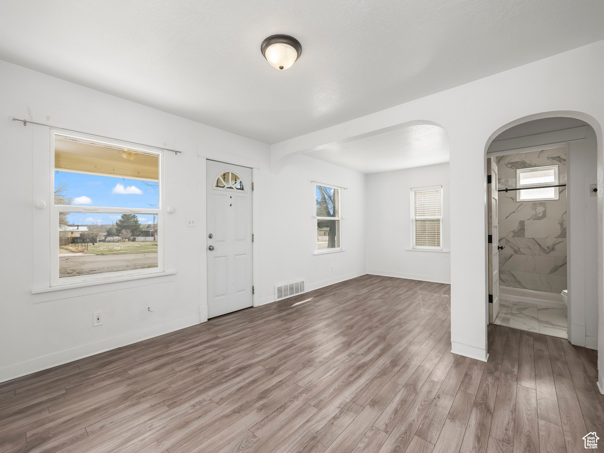 Foyer entrance featuring hardwood / wood-style flooring