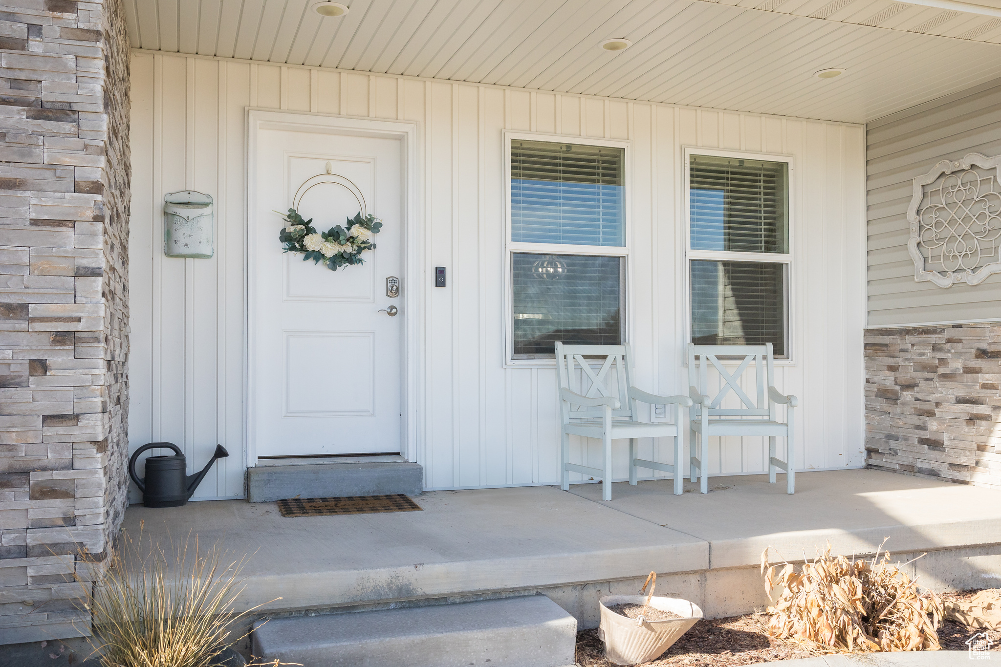 View of exterior entry with a porch