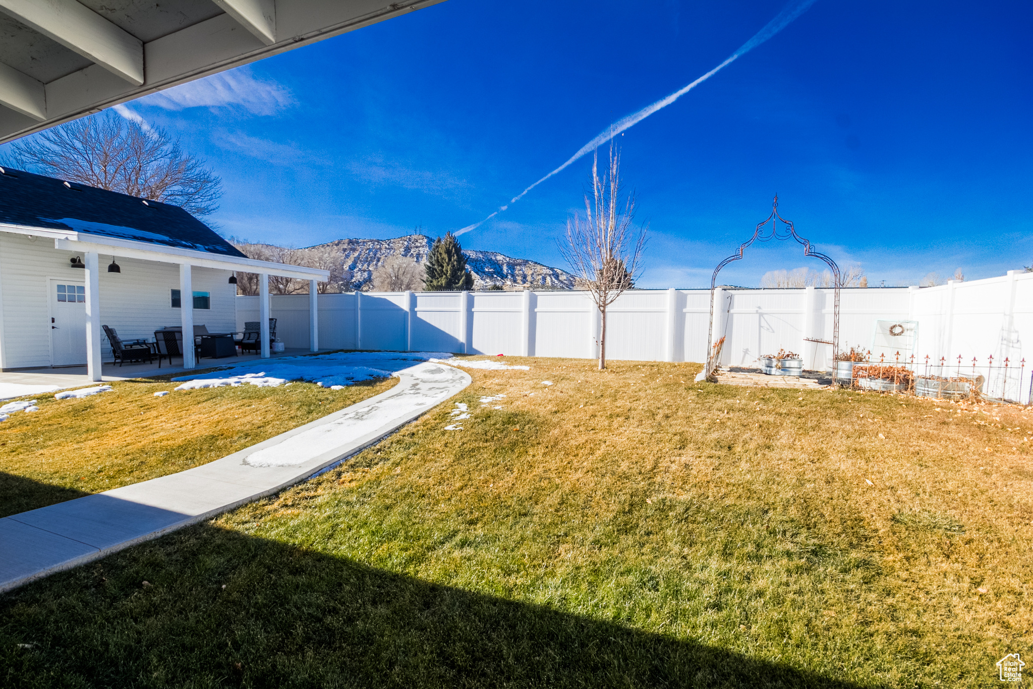 View of yard featuring a mountain view and a patio area