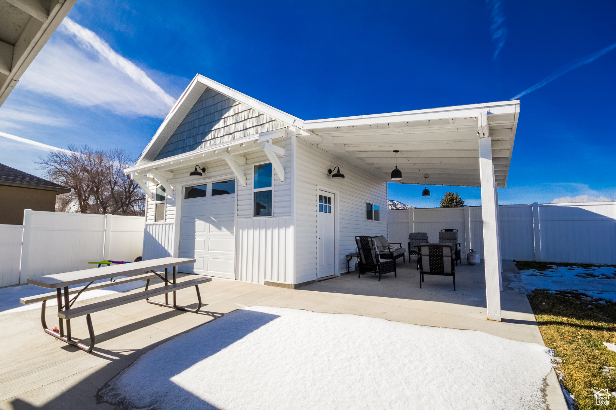 View of patio / terrace with an outbuilding and a garage