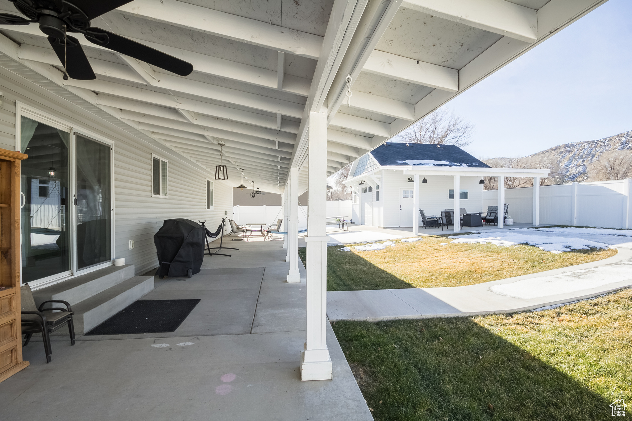 View of patio / terrace featuring a mountain view, area for grilling, and ceiling fan