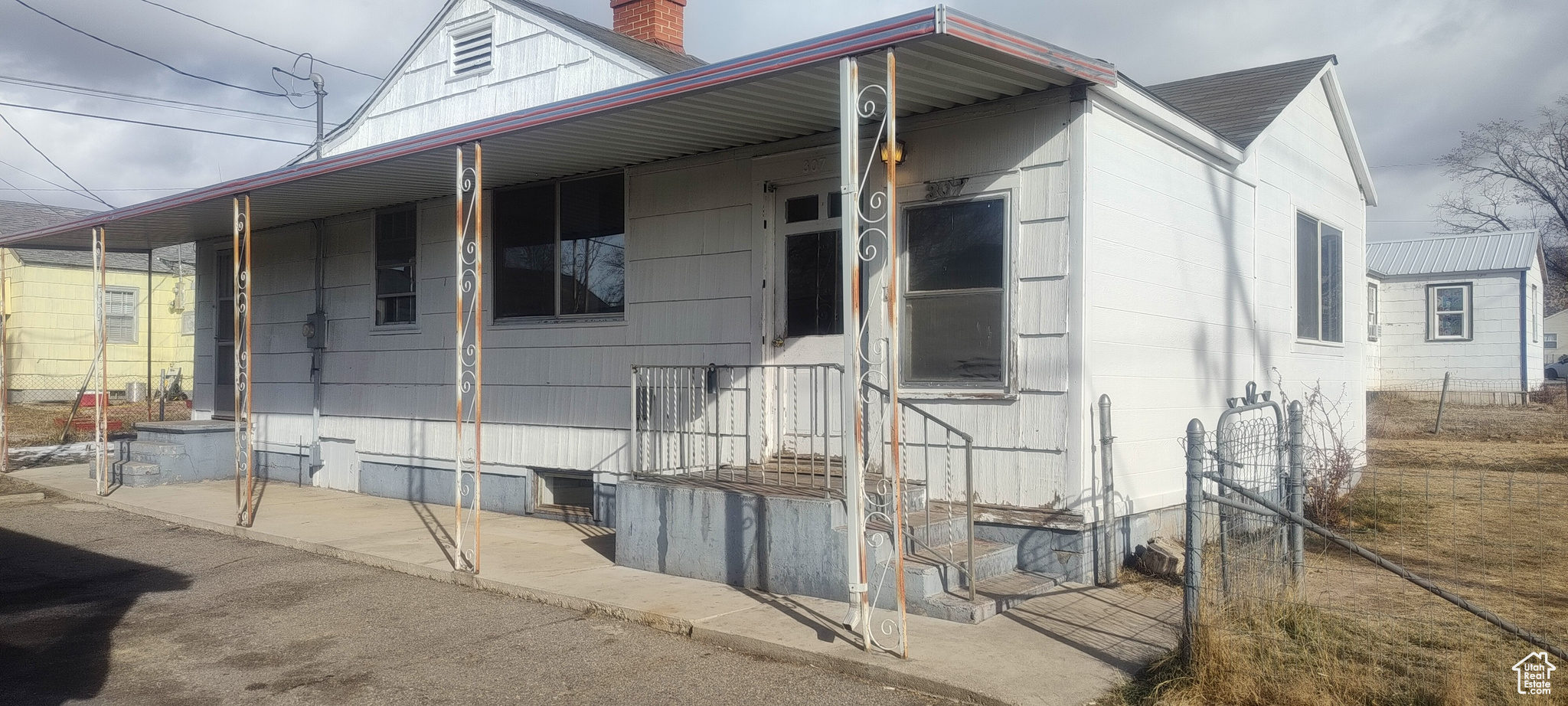 View of side of home with a porch