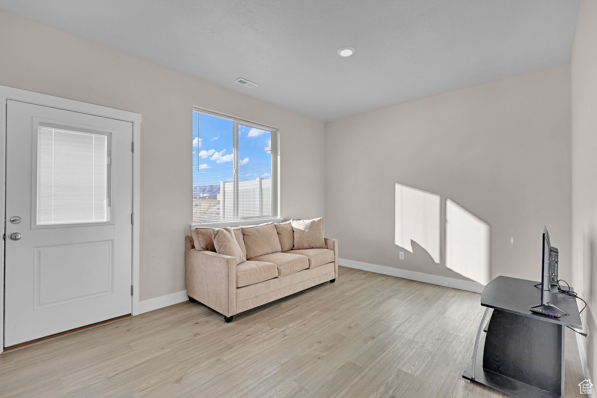 Living room featuring light hardwood / wood-style floors