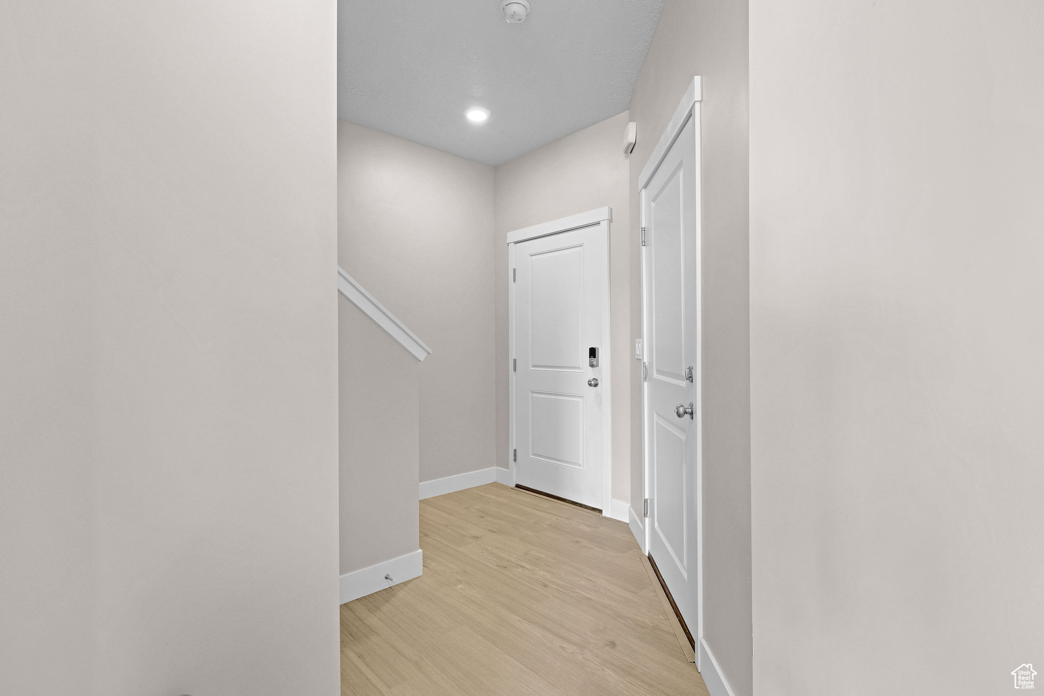 Hall featuring light hardwood / wood-style flooring