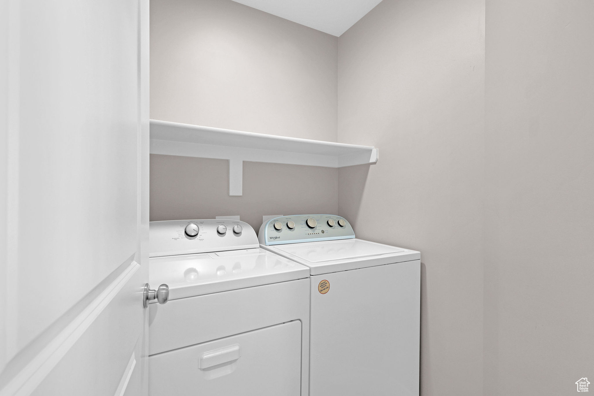 Laundry room with washing machine and clothes dryer