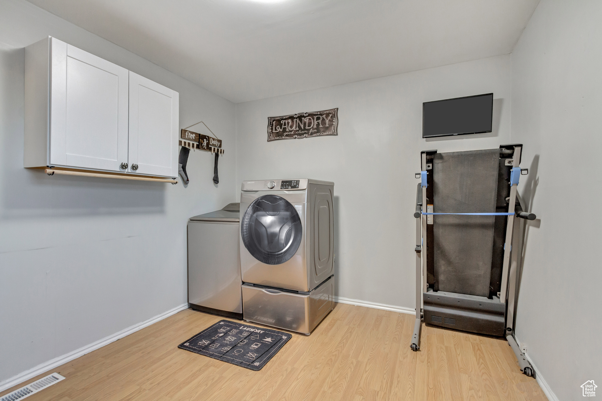 Laundry room with built in cabinet and room for hobbies