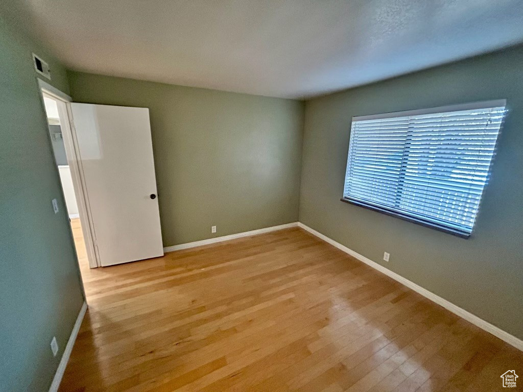 Empty room featuring light wood-type flooring