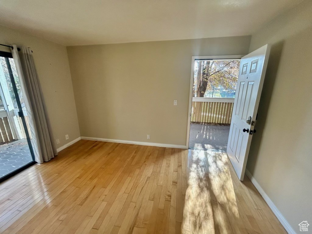 Spare room featuring light wood-type flooring