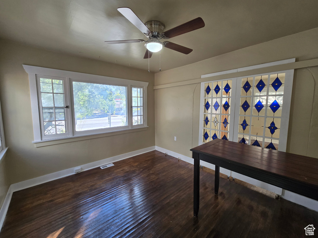 Office area featuring ceiling fan and dark hardwood / wood-style flooring