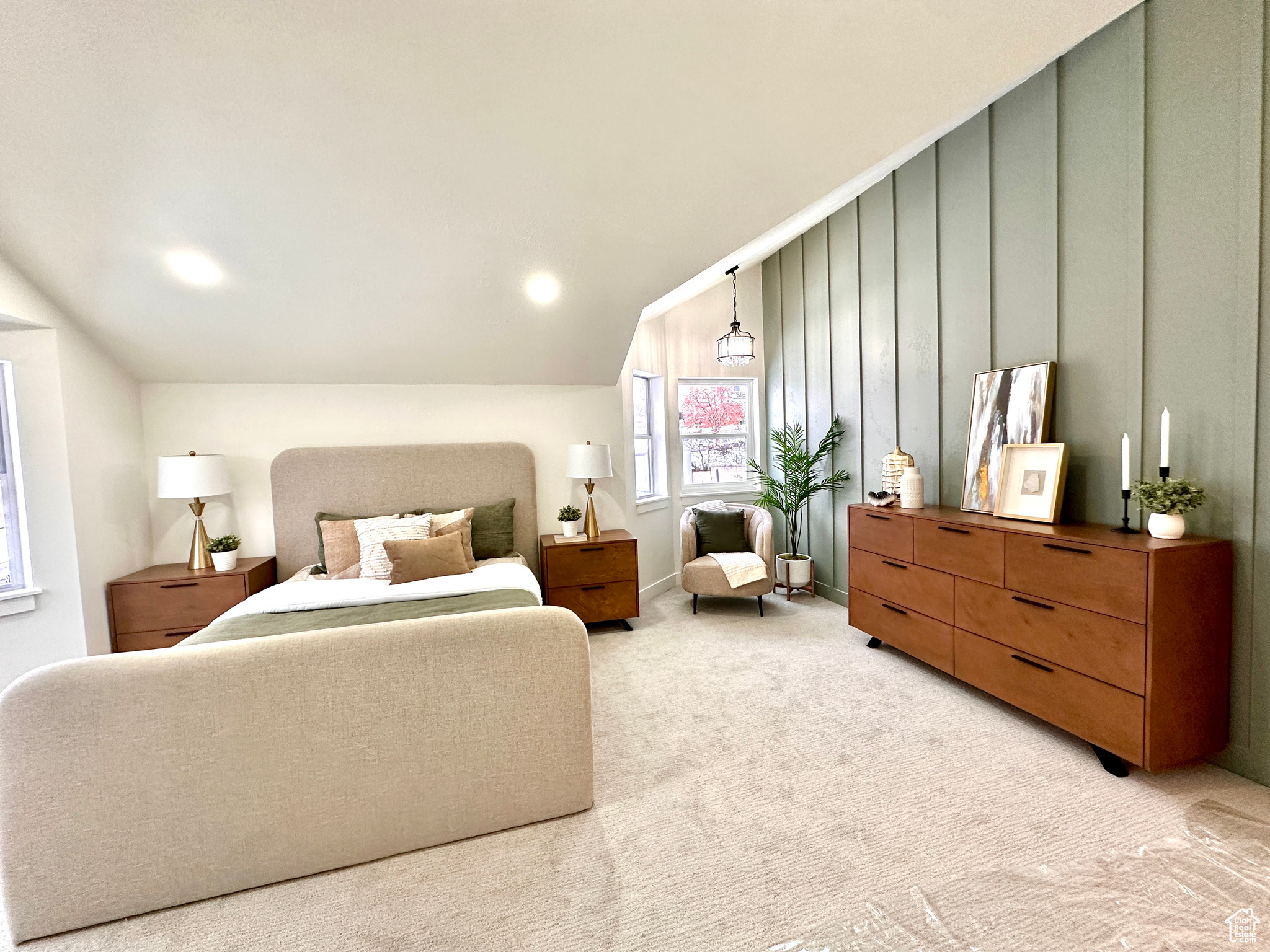 Carpeted bedroom featuring lofted ceiling