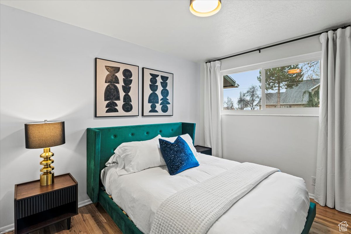 Bedroom featuring wood flooring