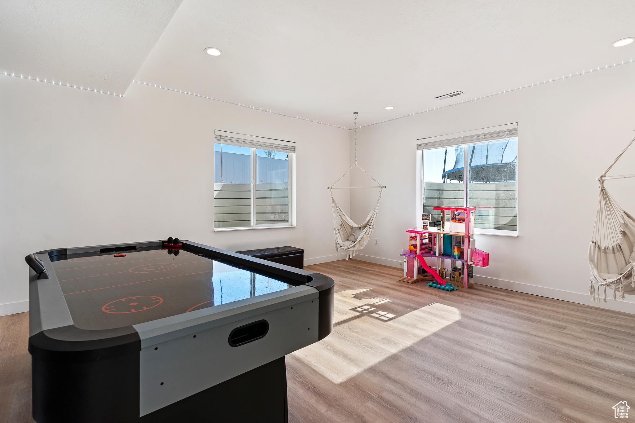 Recreation room featuring light wood-type flooring