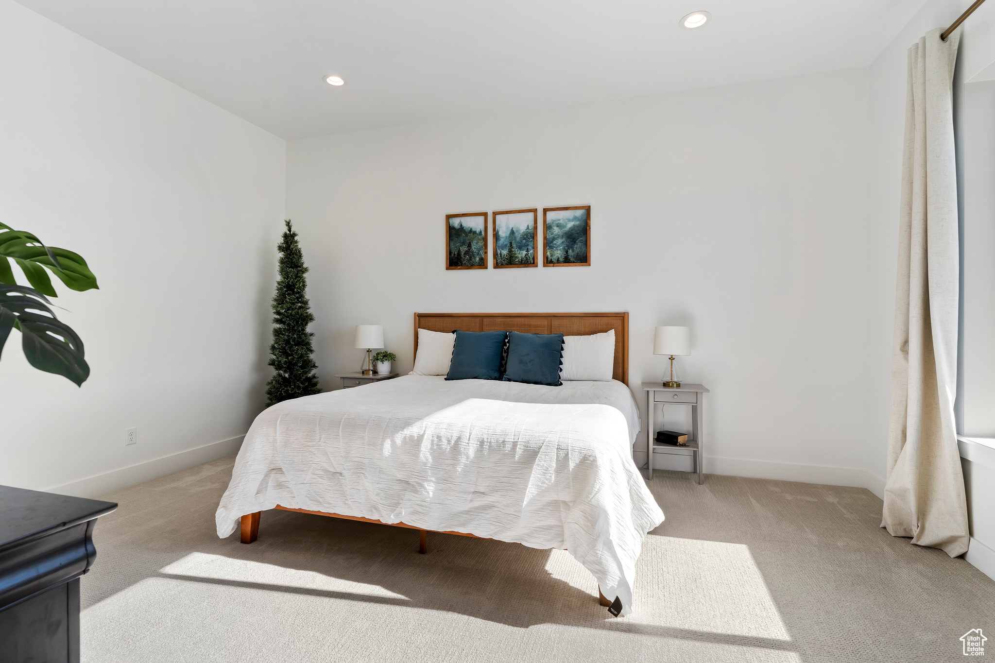 Bedroom featuring light carpet