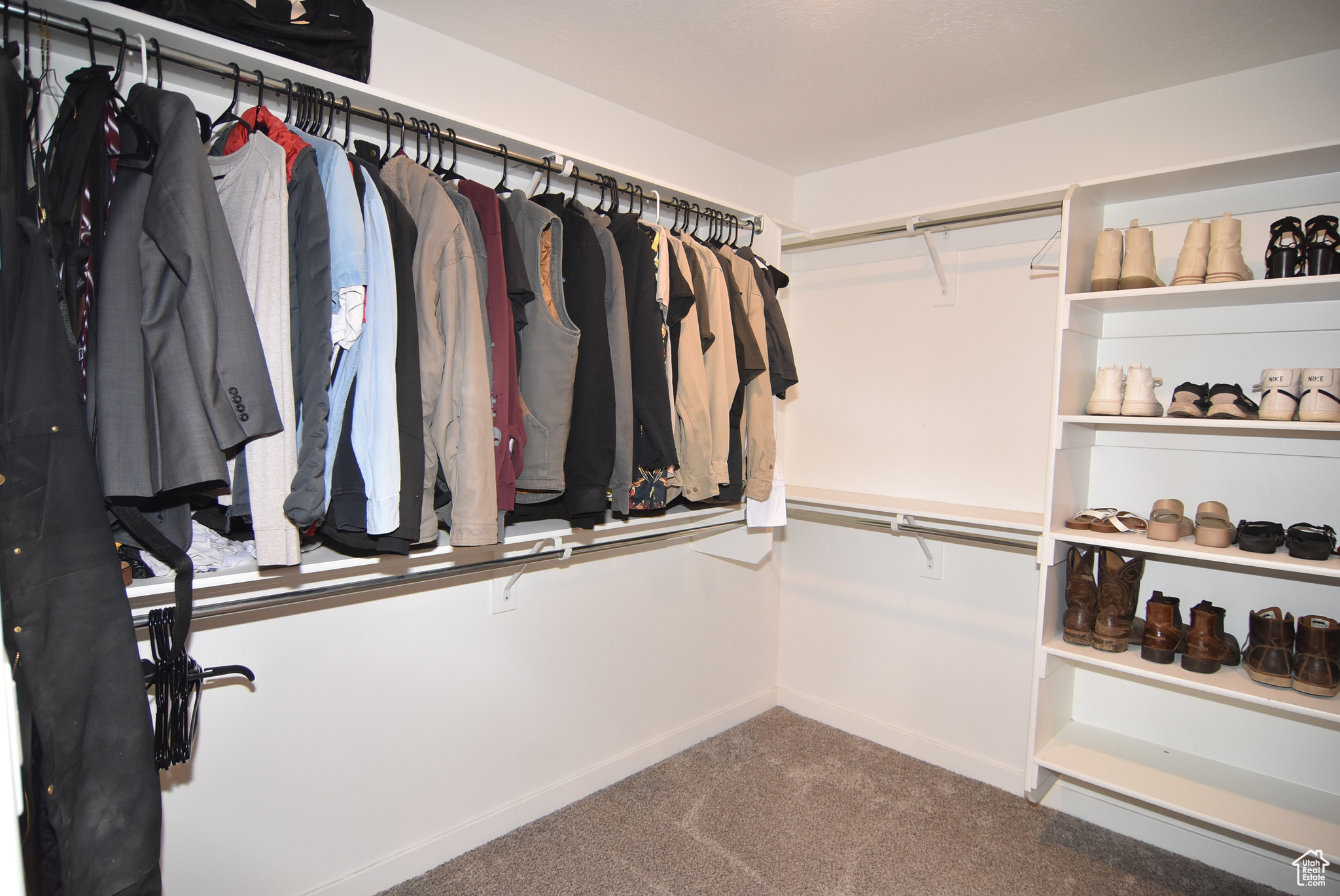 Spacious Master closet featuring carpet flooring