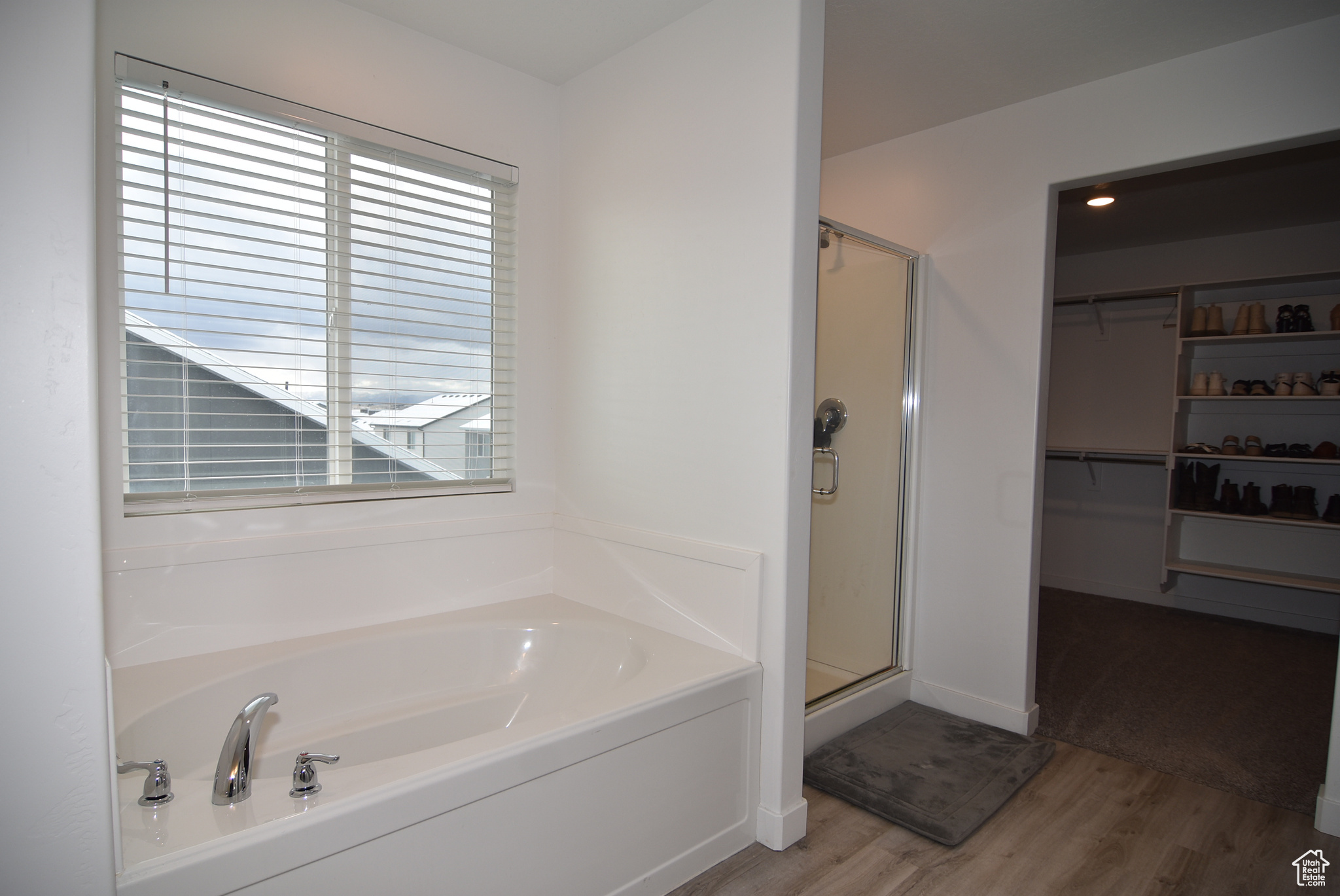 Bathroom with shower with separate bathtub