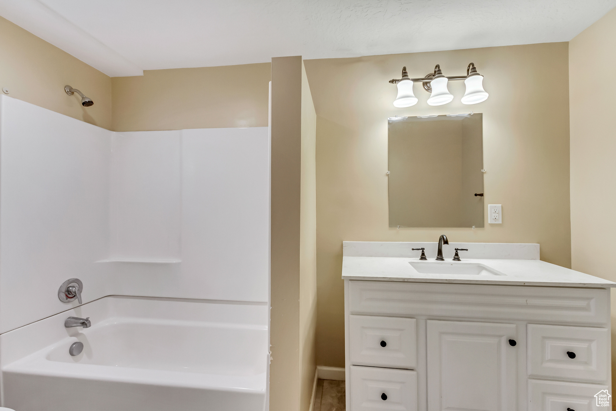 Bathroom featuring vanity and tub / shower combination