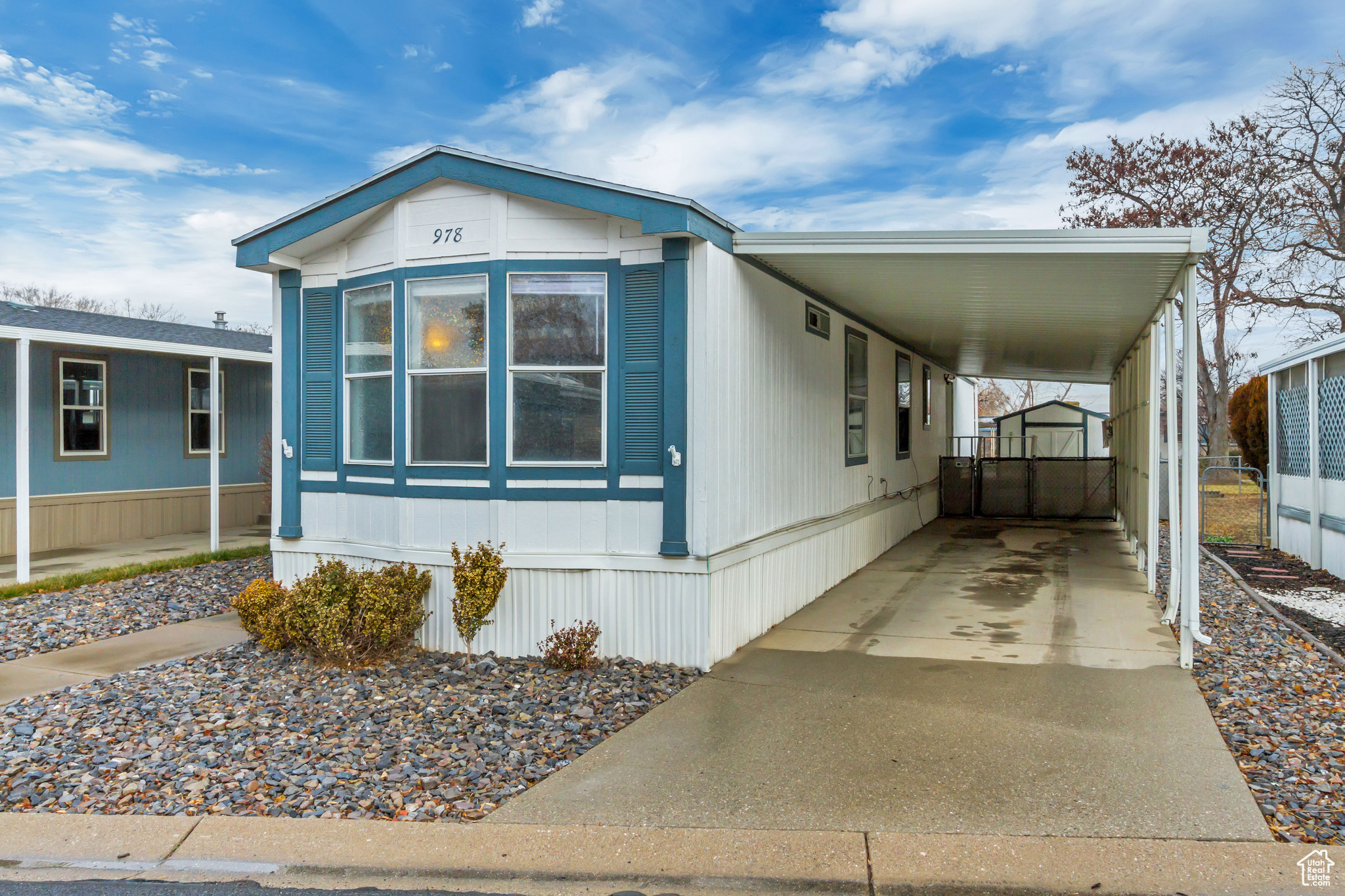 View of front of house and two-car deep carport