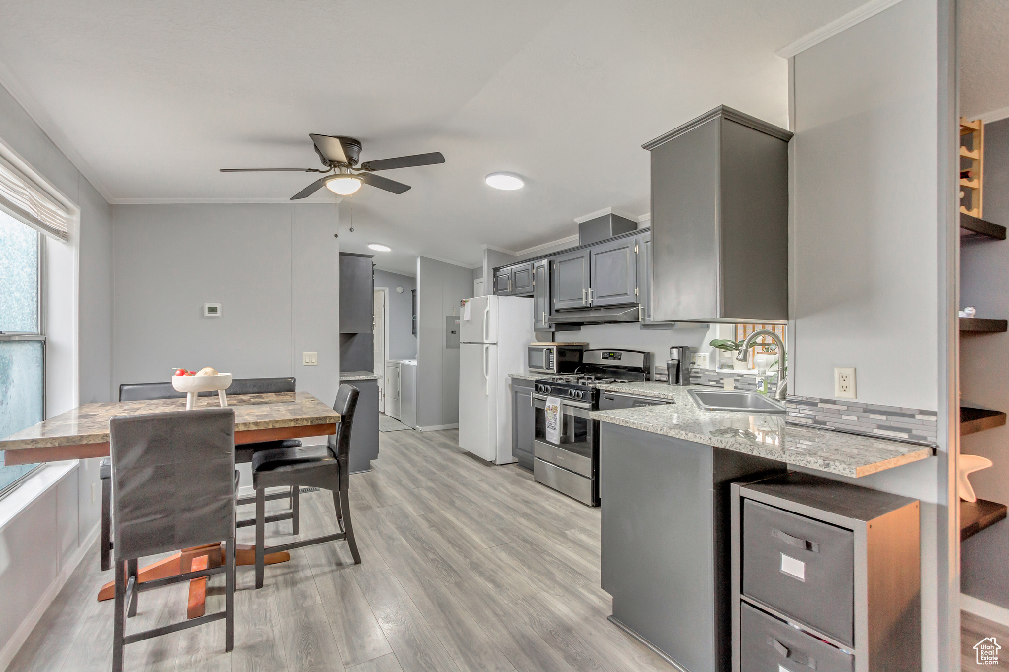 Kitchen featuring granite countertops and updated cabinetry.