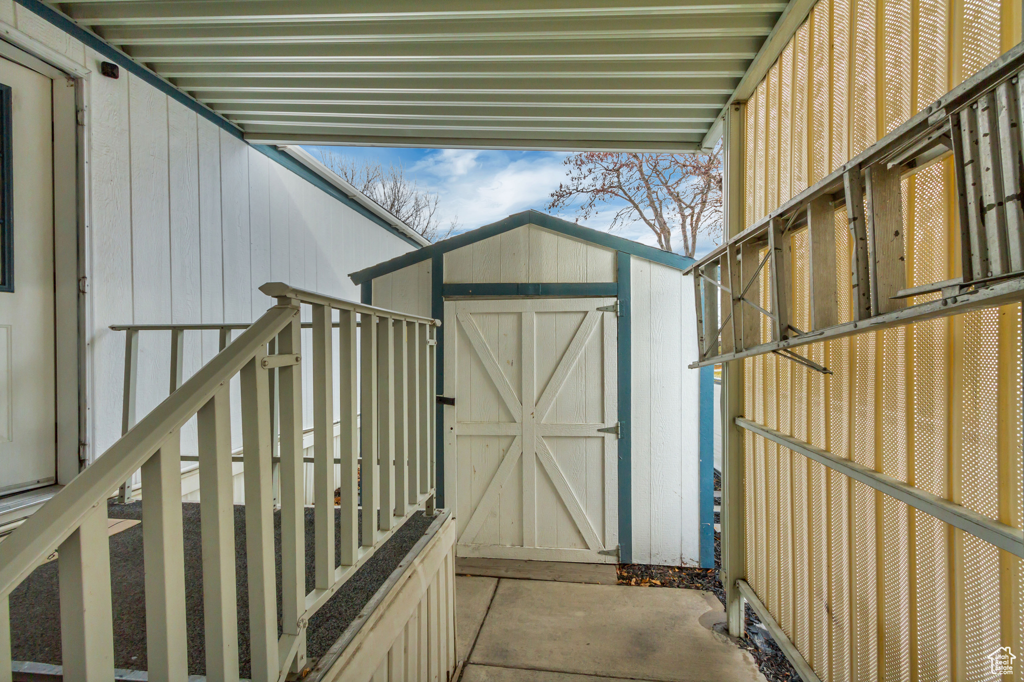 Exterior space with storage shed.