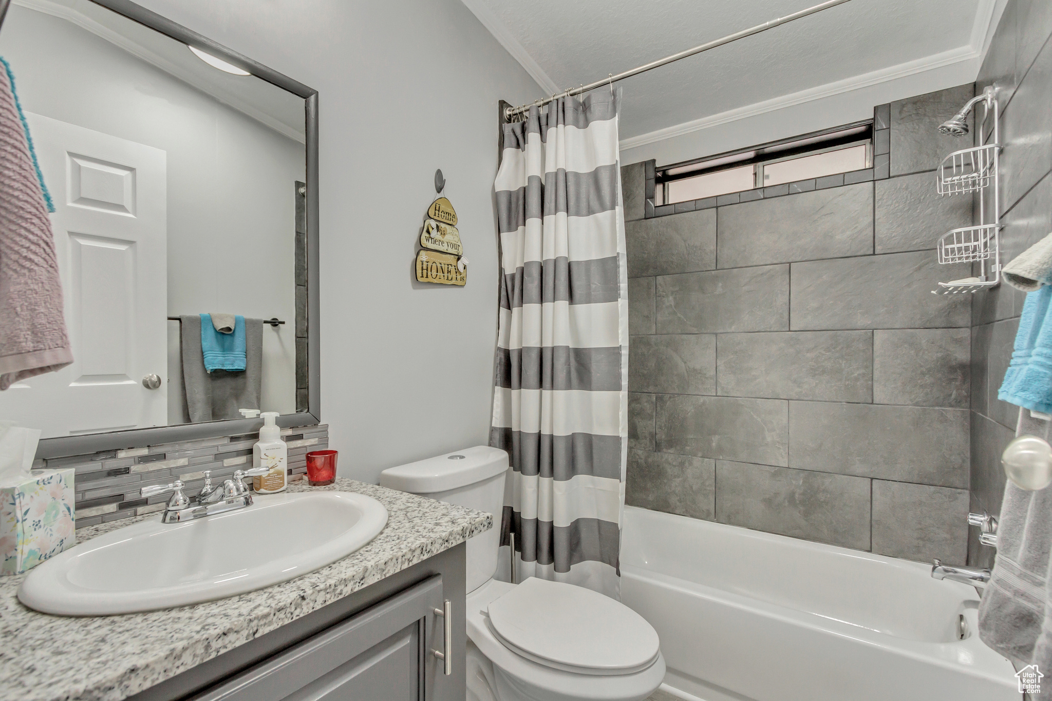 Second bathroom with granite countertops. New flooring, toilet, tub, tile, and hardware.