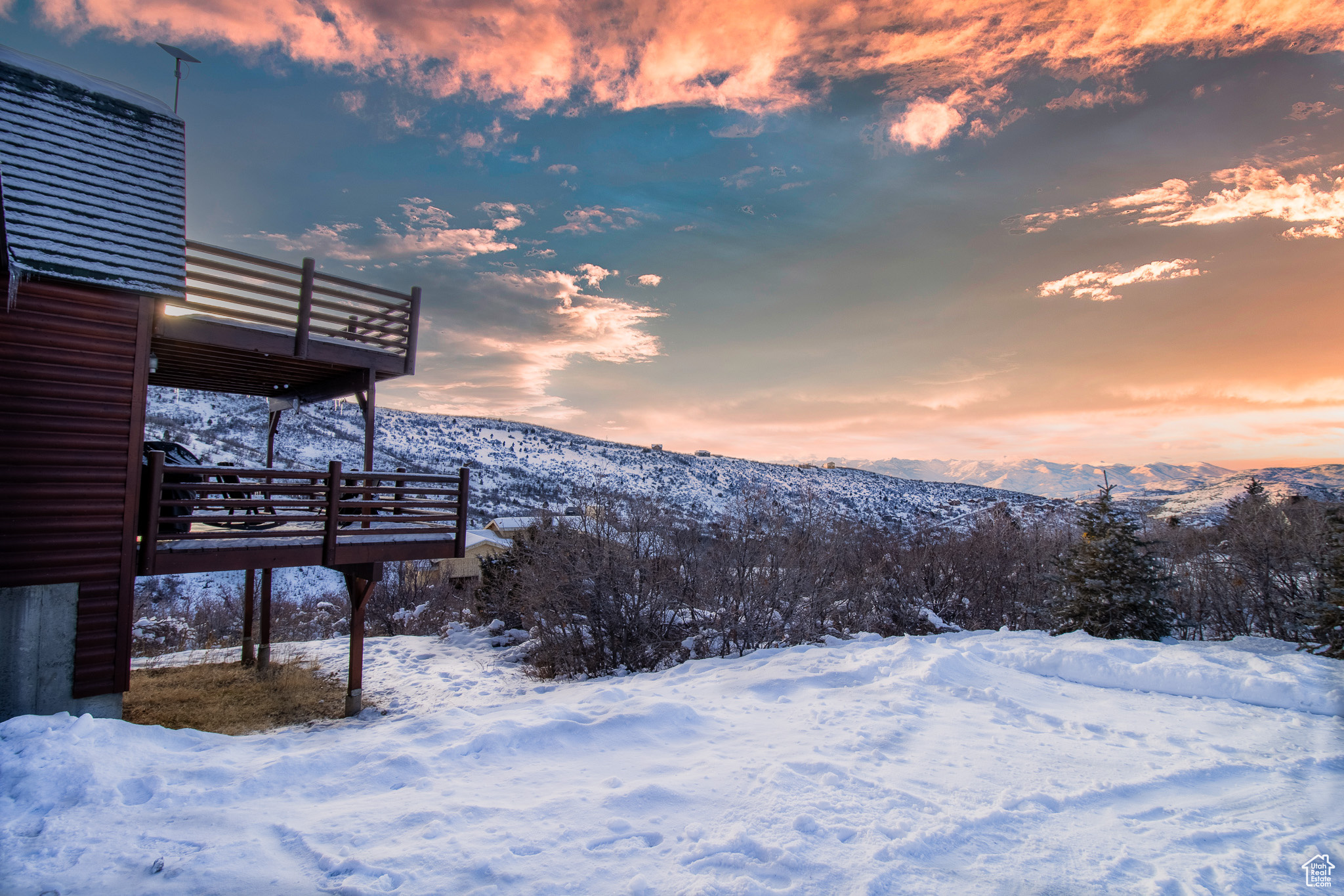 Snowy yard with a mountain view