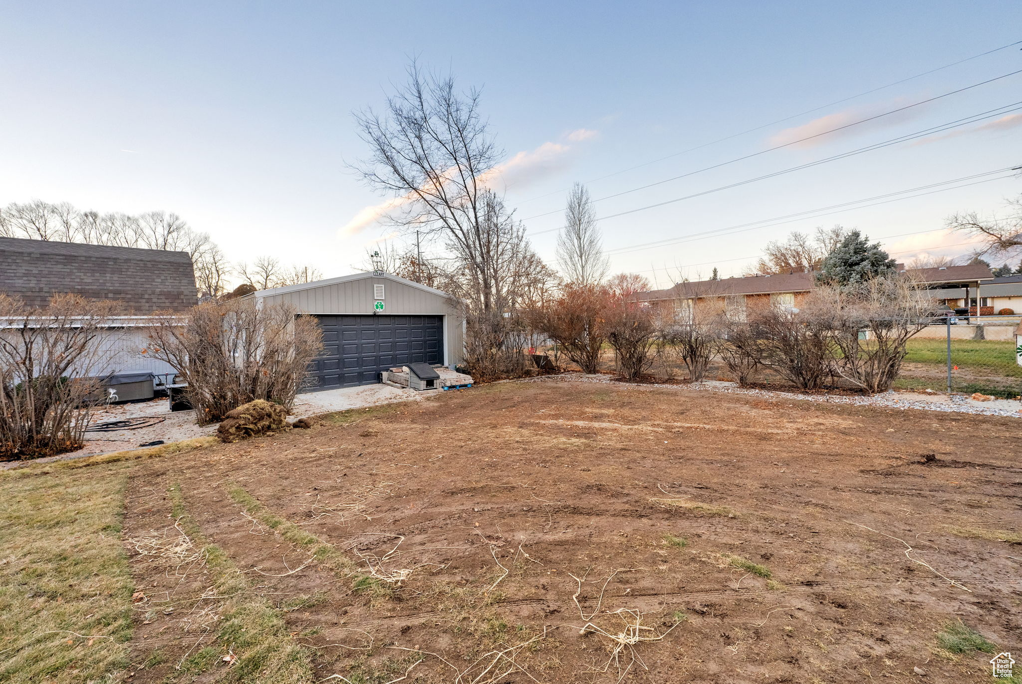 View of yard with an outdoor structure and a garage