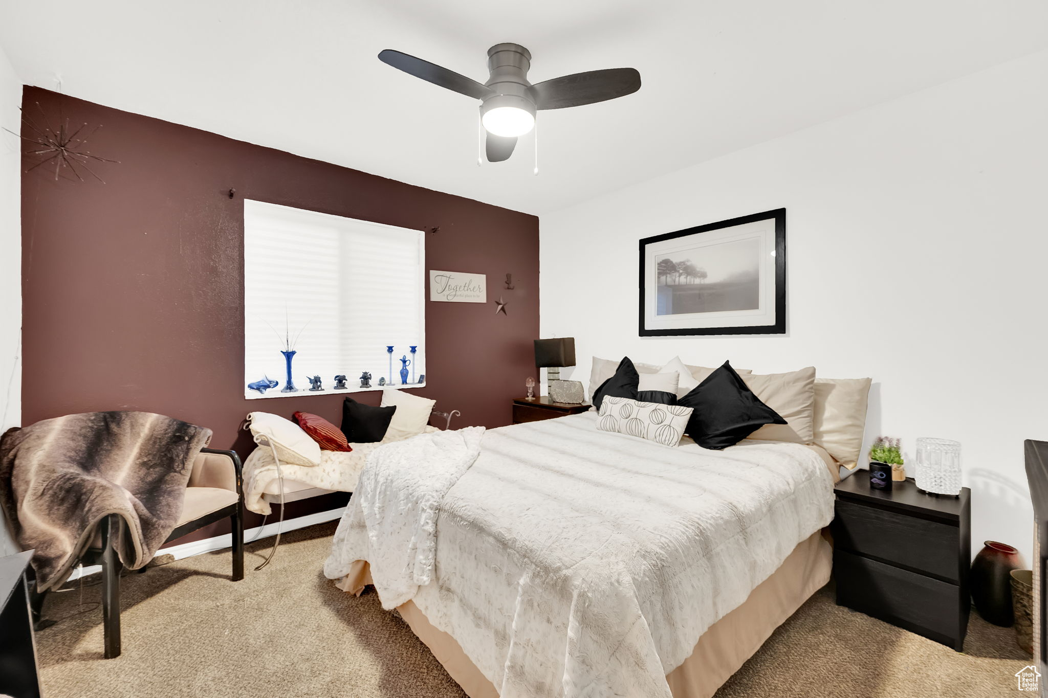 Bedroom featuring light carpet and ceiling fan