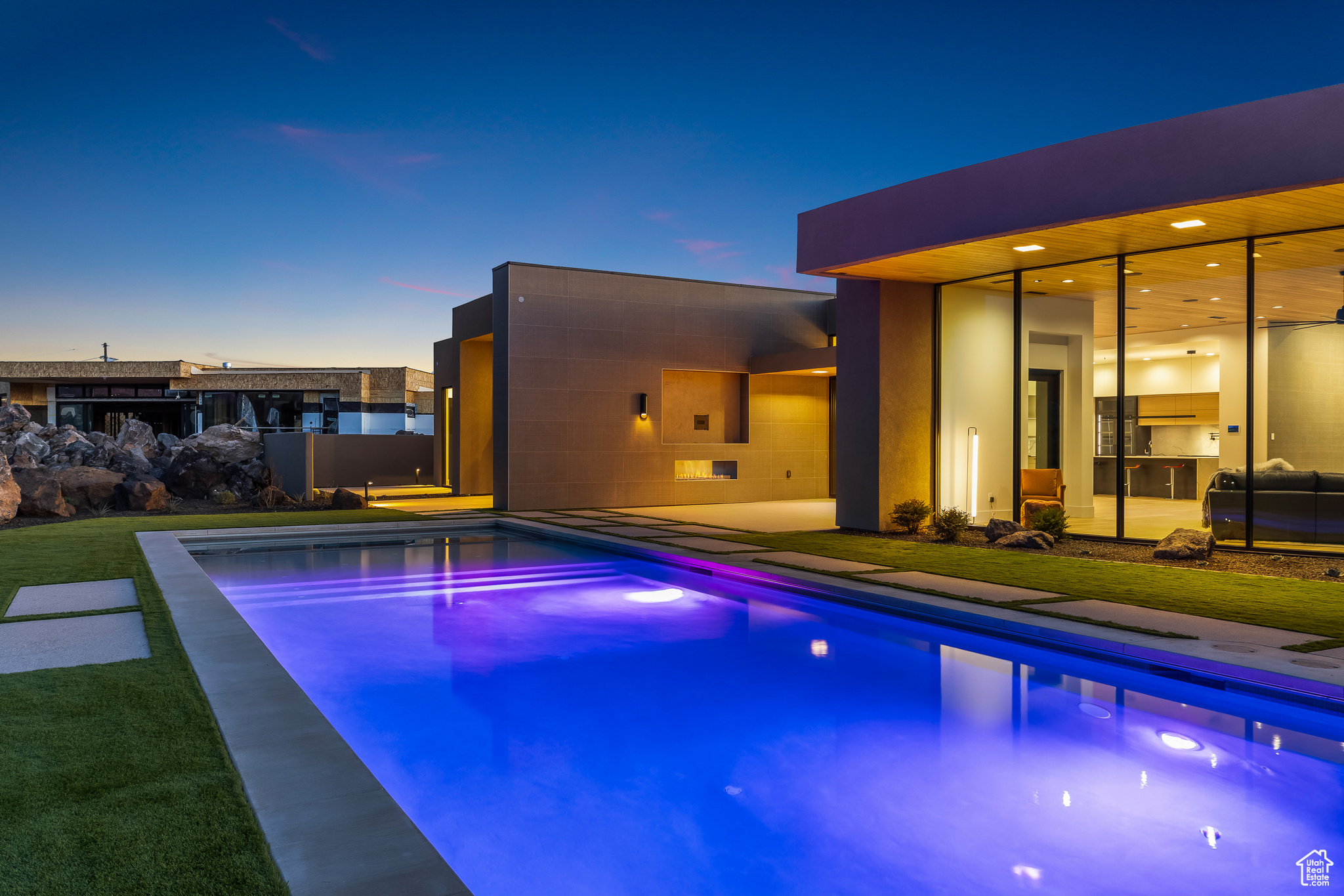 View of pool at dusk