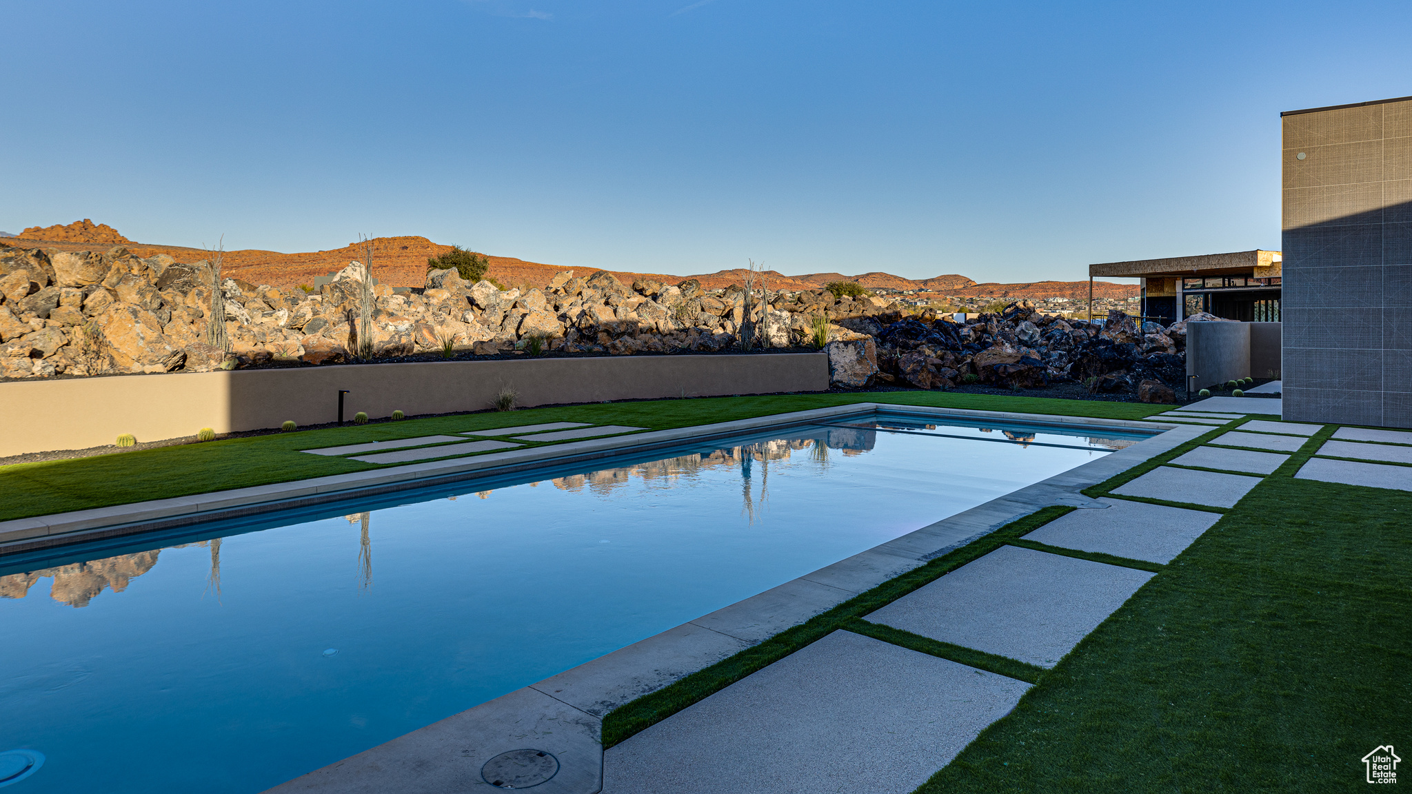 View of swimming pool featuring a mountain view and a yard