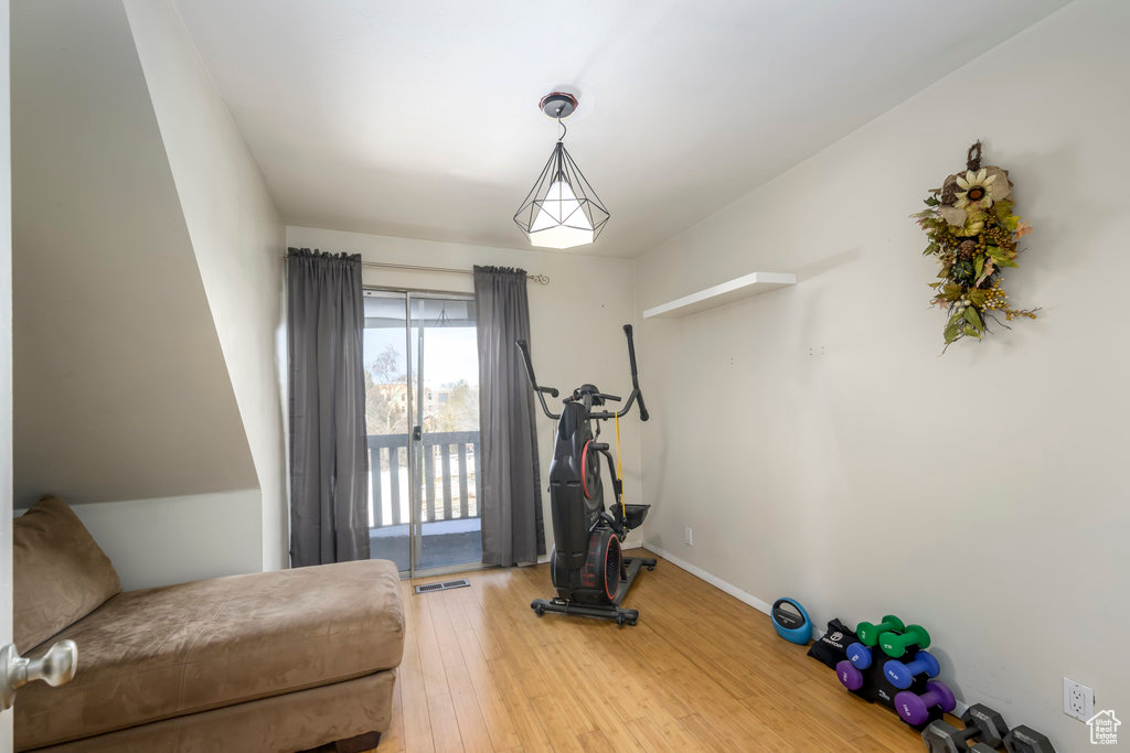 Exercise room with wood-type flooring