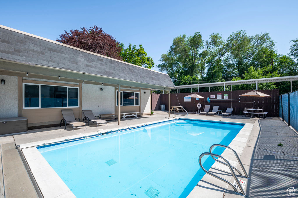 View of pool featuring a patio area