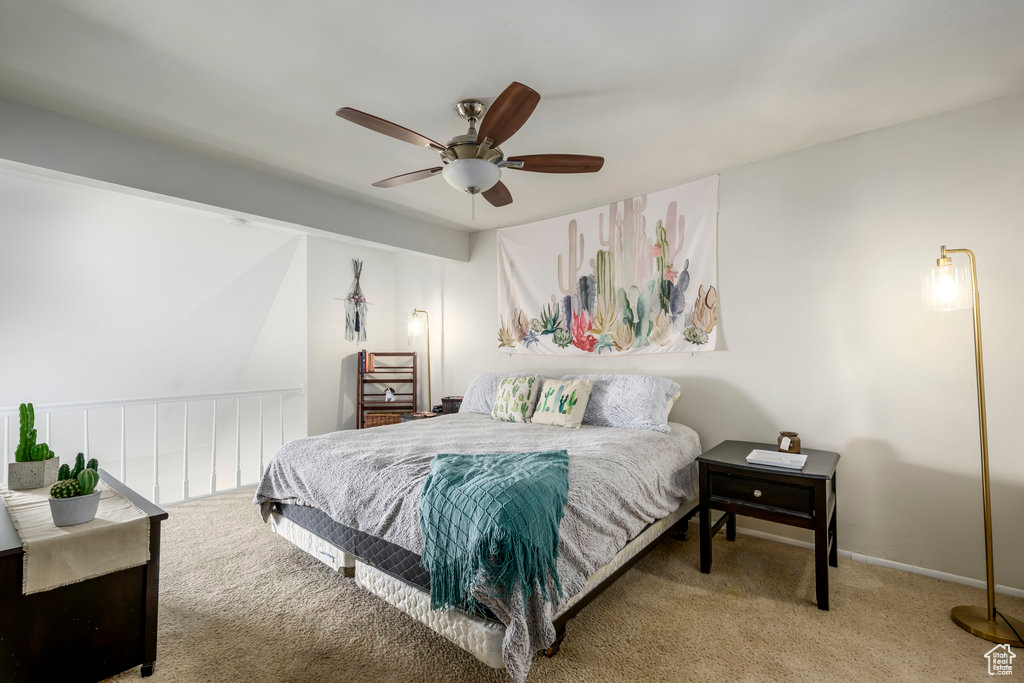 Carpeted bedroom with ceiling fan