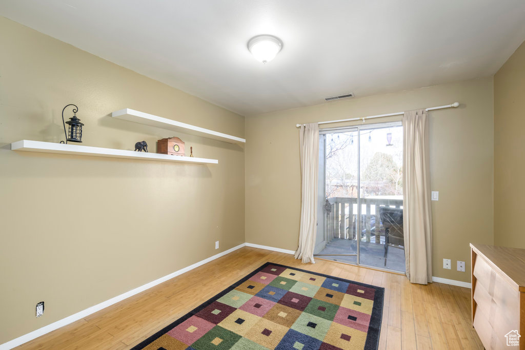 Doorway to outside with light wood-type flooring